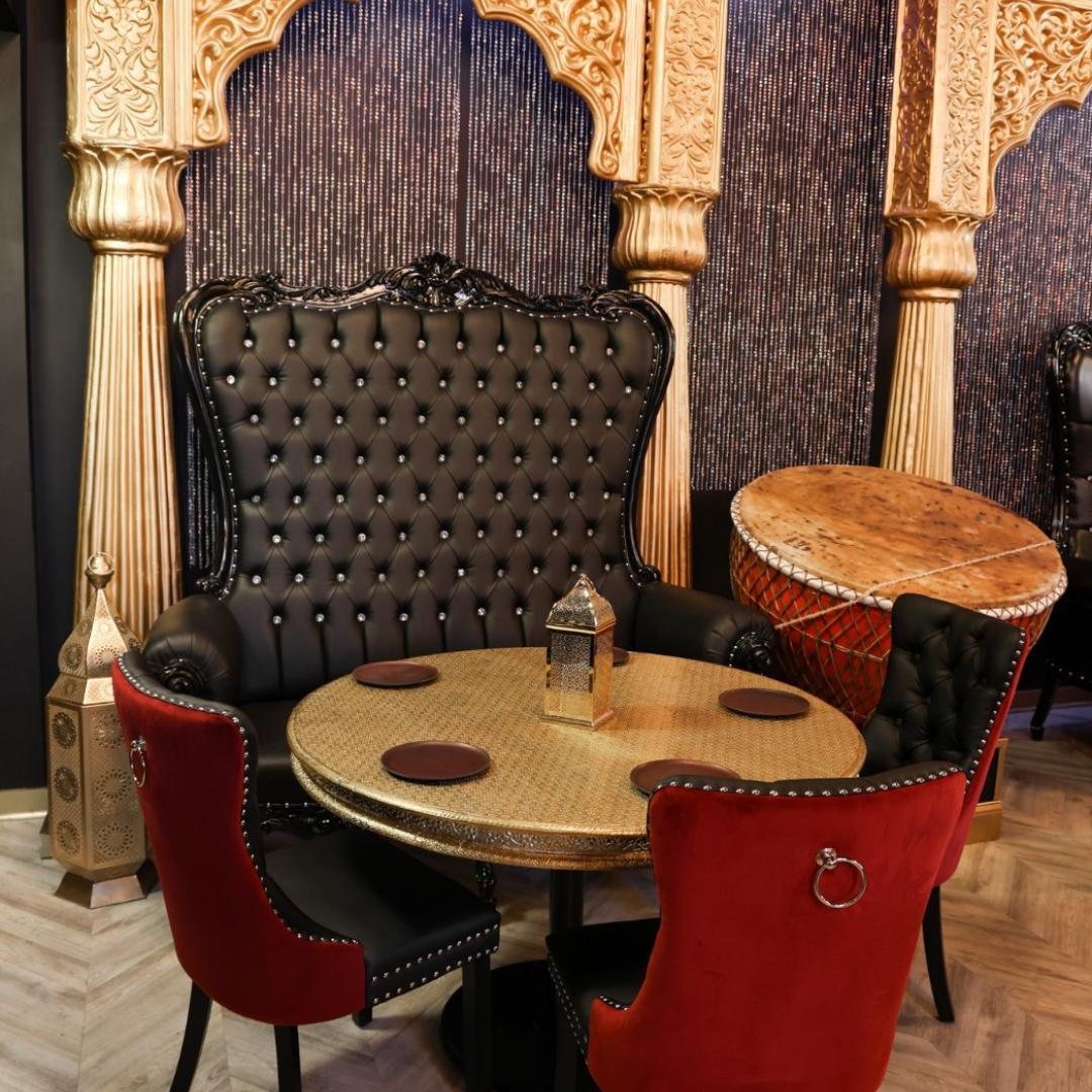 A corner table set for the evening